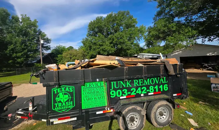 Texas Trash Assassins dump trailer loaded with junk at a residential job