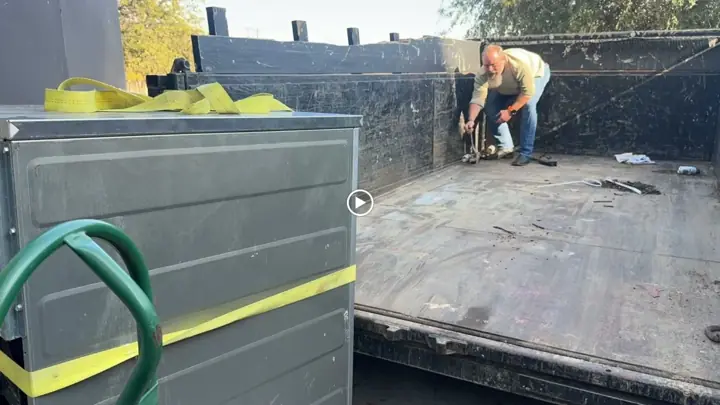 Strapping down a load in the dump trailer
