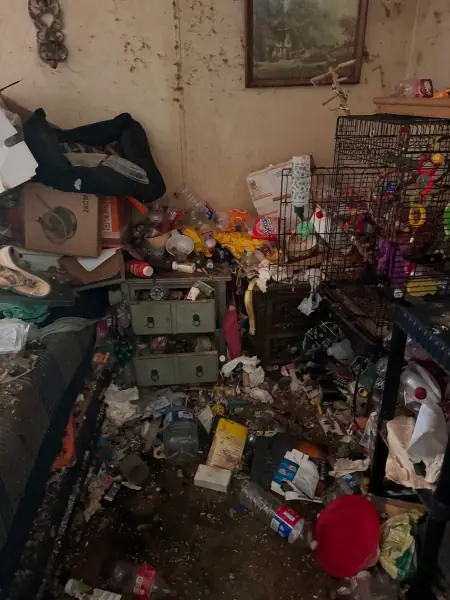 Room packed with clutter ahead of a cleanout